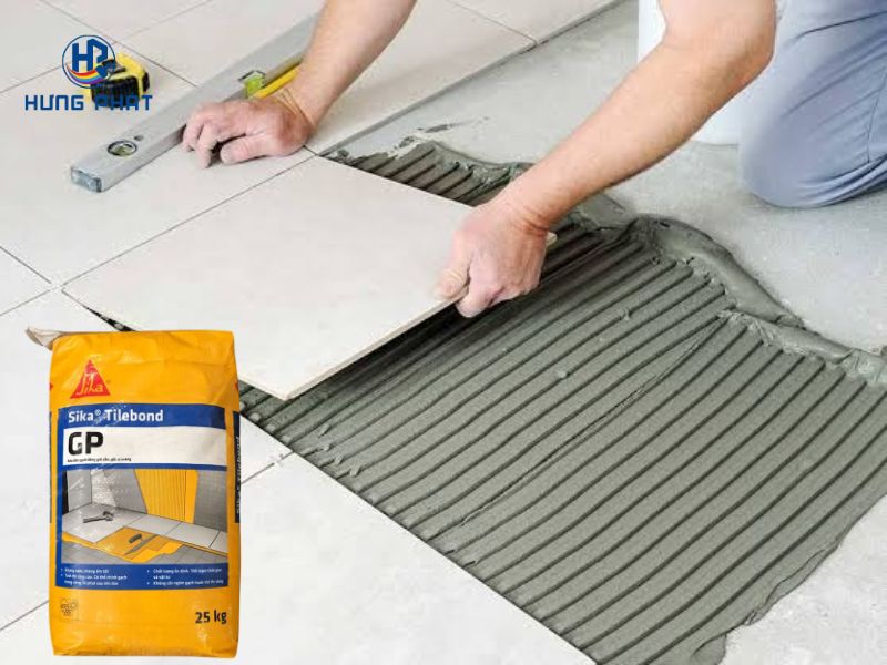 Mặt cắt lớp keo dán gạch phủ kín mặt sau viên gạch ceramic trên nền bê tông Mặt cắt lớp keo dán gạch phủ kín mặt sau viên gạch ceramic trên nền bê tông